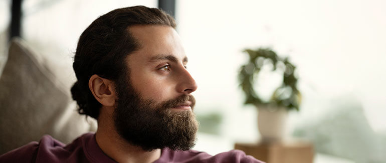 Man looking out of window